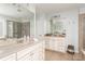 Bright bathroom featuring double vanity sinks, granite countertops, and a glass-enclosed shower at 24 Rockland Pl, Decatur, GA 30030