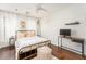 Bright bedroom with hardwood floors, white walls, and a comfy bed at 24 Rockland Pl, Decatur, GA 30030