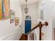 Bright entryway with hardwood floors, chandelier, stylish artwork, and a blue front door at 24 Rockland Pl, Decatur, GA 30030