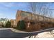 Back exterior of a townhome with multiple levels and a deck at 24 Rockland Pl, Decatur, GA 30030