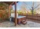 Outdoor hot tub featuring wood trim, stone patio, with wooden fence, great for relaxing and entertaining at 24 Rockland Pl, Decatur, GA 30030
