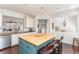 Open kitchen featuring a butcher block island with seating and stainless steel appliances at 24 Rockland Pl, Decatur, GA 30030