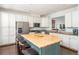 Well-lit kitchen featuring a large island, stainless steel appliances, and ample cabinet space at 24 Rockland Pl, Decatur, GA 30030