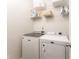 A functional laundry room with a washer, dryer, and practical shelving for storage solutions at 24 Rockland Pl, Decatur, GA 30030