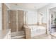 Bright main bathroom features a standalone shower and relaxing soaking tub at 24 Rockland Pl, Decatur, GA 30030