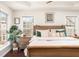 Comfortable main bedroom showcases hardwood floors, a ceiling fan, and bright windows at 24 Rockland Pl, Decatur, GA 30030