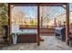 Relax on the stone patio with a hot tub, grill, and wooden privacy fence, perfect for outdoor entertaining at 24 Rockland Pl, Decatur, GA 30030