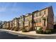 Street view of beautiful brick townhomes with garages and sidewalk access at 24 Rockland Pl, Decatur, GA 30030