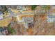 An aerial view shows the layout of this hillside lot with mature trees, and a private back deck at 325 William Falls Dr, Canton, GA 30114