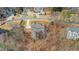 An aerial view shows the layout of this hillside lot with mature trees, and a private back deck at 325 William Falls Dr, Canton, GA 30114