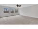 Spacious bedroom with neutral carpet, ceiling fan, and large windows at 325 William Falls Dr, Canton, GA 30114