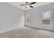 Bedroom with carpet, a ceiling fan and two bright windows with wooded views at 325 William Falls Dr, Canton, GA 30114