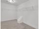 Walk-in closet featuring neutral carpet, white wire shelving, and white walls at 325 William Falls Dr, Canton, GA 30114