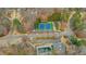 Aerial view of community amenities including tennis courts and a swimming pool for residents' recreation at 325 William Falls Dr, Canton, GA 30114