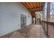 Wide deck with stained wood flooring and railings, featuring an outdoor staircase at 325 William Falls Dr, Canton, GA 30114