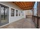 Covered deck with stained wood flooring, showing the siding and railings with view of the outdoors at 325 William Falls Dr, Canton, GA 30114
