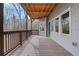 Wide deck with stained wood flooring, featuring the siding and railings with view of the outdoors at 325 William Falls Dr, Canton, GA 30114