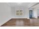 Dining room featuring hardwood floors, neutral colors, and a view of the front entrance at 325 William Falls Dr, Canton, GA 30114