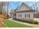 Beautifully landscaped front yard with lush green lawn and charming walkway at 325 William Falls Dr, Canton, GA 30114