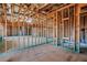 Interior view of an unfinished home, showing the exposed stud framing, ceiling joists, and subfloor at 325 William Falls Dr, Canton, GA 30114