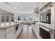 Spacious, bright kitchen featuring stainless steel appliances and a large island at 325 William Falls Dr, Canton, GA 30114