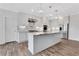 Bright kitchen with stainless steel appliances, island, and modern pendant lighting at 325 William Falls Dr, Canton, GA 30114