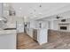 Open-concept kitchen with stainless steel appliances and connection to living area at 325 William Falls Dr, Canton, GA 30114
