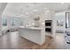 Open-concept kitchen with an island, breakfast nook, and stainless steel appliances at 325 William Falls Dr, Canton, GA 30114