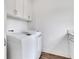Modern laundry room with new washer and dryer units and storage at 325 William Falls Dr, Canton, GA 30114