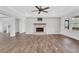 Open living space with a fireplace, hardwood floors, and modern finishes, perfect for relaxing at 325 William Falls Dr, Canton, GA 30114