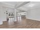 Bright, open-concept living room with hardwood floors, leading into the dining room and kitchen at 325 William Falls Dr, Canton, GA 30114