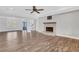 Living area showcasing hardwood flooring, a cozy fireplace, and an inviting, open layout at 325 William Falls Dr, Canton, GA 30114