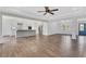 Open-concept living room seamlessly flows into the kitchen, featuring hardwood floors and ample natural light at 325 William Falls Dr, Canton, GA 30114