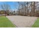 Outdoor volleyball court with a sand surface, set in a landscaped backyard near a playground at 325 William Falls Dr, Canton, GA 30114