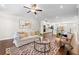 Open concept living room seamlessly connects to the kitchen, creating a spacious and inviting atmosphere at 3538 Davenport Rd, Duluth, GA 30096