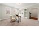 Bright home office featuring large windows, built-in bookshelves, and a modern desk with a comfortable chair at 3538 Davenport Rd, Duluth, GA 30096
