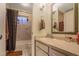 Neutral bathroom with a tub, shower, updated vanity, and mirrored cabinet at 5600 Kingsport Dr, Atlanta, GA 30342