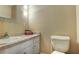 Well-maintained bathroom featuring a functional layout with a toilet and a vanity at 5600 Kingsport Dr, Atlanta, GA 30342