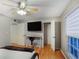 Bright bedroom with a large window, desk, closet, and hardwood floors at 5600 Kingsport Dr, Atlanta, GA 30342