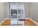 Cozy dining room with hardwood floors and sliding glass doors leading to an outdoor patio at 5600 Kingsport Dr, Atlanta, GA 30342