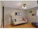 Cozy living room with hardwood floors, a comfortable white sofa, and artistic wall decor at 5600 Kingsport Dr, Atlanta, GA 30342