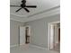 Bedroom with carpeted floor, ceiling fan, and direct access to the bathroom and other living areas at 607 Leland Pkwy, Cumming, GA 30041