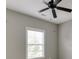 Neutral bedroom featuring a ceiling fan and a window at 607 Leland Pkwy, Cumming, GA 30041