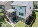 Rear exterior view featuring a deck, landscaped yard, and outdoor living space at 607 Leland Pkwy, Cumming, GA 30041