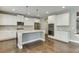 This kitchen features stainless steel appliances and a large island at 607 Leland Pkwy, Cumming, GA 30041
