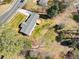 An aerial view of a single-Gathering home featuring a spacious yard with mature trees and a wooden deck at 3784 Robinson Ne Rd, Marietta, GA 30068