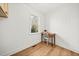 Bedroom featuring wood floors, white walls and a window overlooking the exterior at 3784 Robinson Ne Rd, Marietta, GA 30068