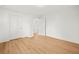 Bedroom features wood floors, white walls and a door to another room at 3784 Robinson Ne Rd, Marietta, GA 30068