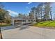 Wide view of home from the driveway, carport, and landscaping. Lots of parking and space for entertaining at 3784 Robinson Ne Rd, Marietta, GA 30068