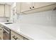 Close-up of bright kitchen countertop, showing the sink, faucet, and white subway tile backsplash at 3784 Robinson Ne Rd, Marietta, GA 30068